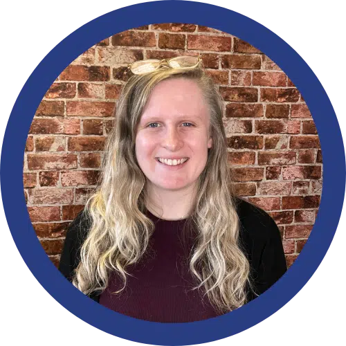 portrait of hollie agombar in a top and black cardigan 