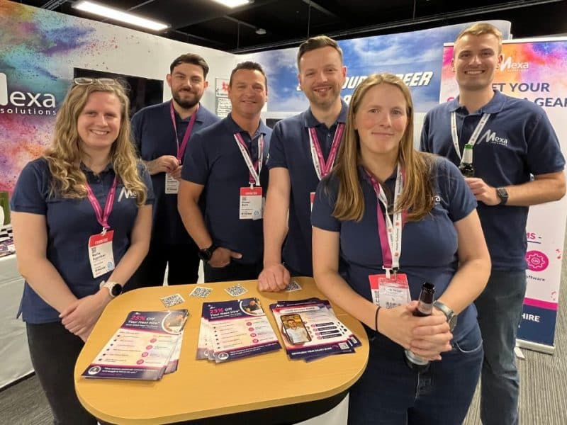 mexa solutions team stood at their stand