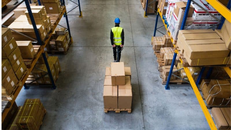 man in a warehouse working 