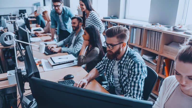 people working in an office on there pc on the internet safely 