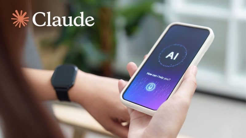 claude ai on a screen of a phone of a lady holding it