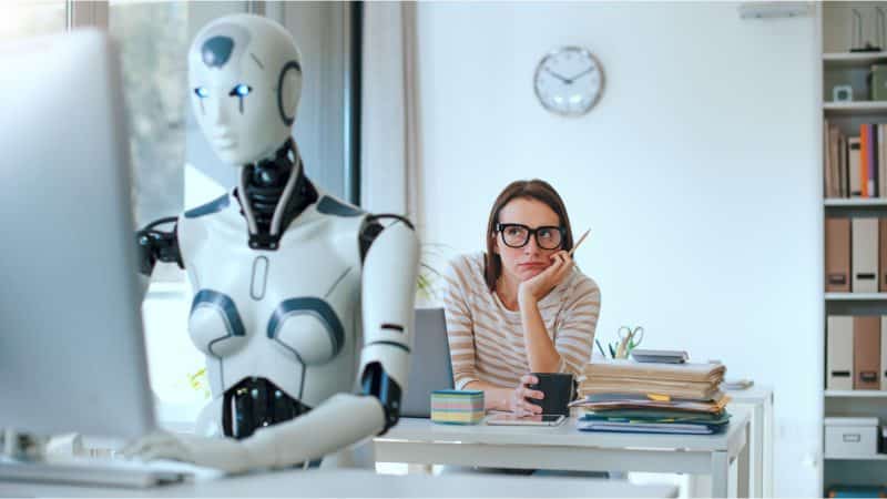 ai robot sat across from a woman looking fed up